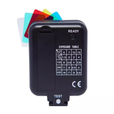 Black light meter with exposure table and color cards on a white background